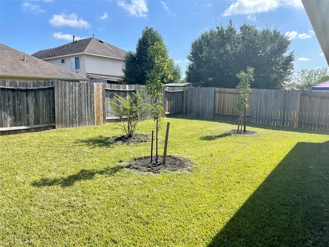 a swimming pool with wooden fence