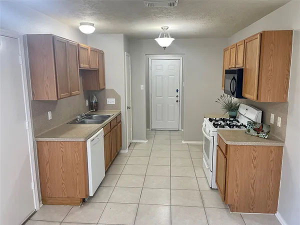 a kitchen with a cabinets and steel stove