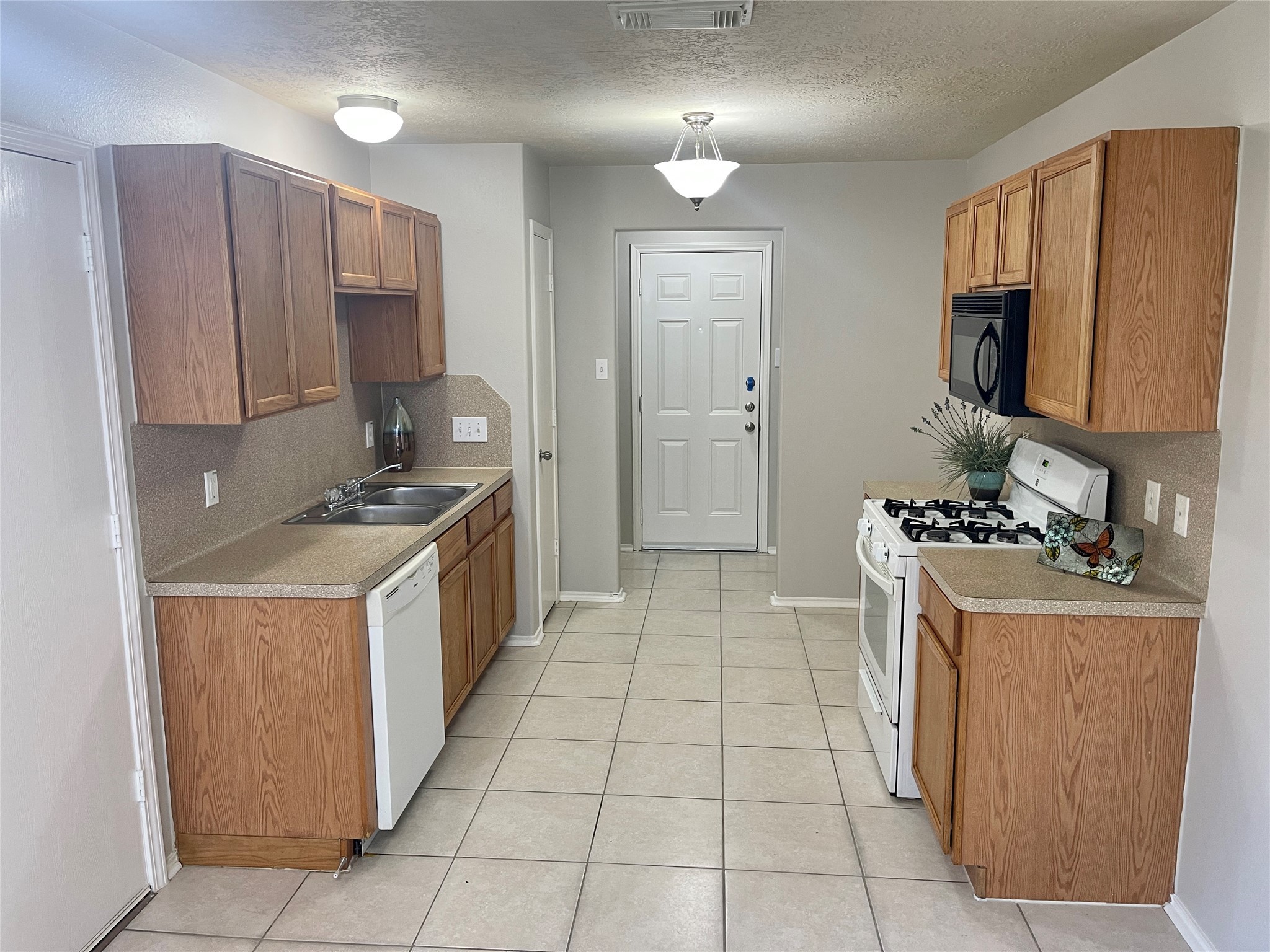 9011 Serena Lane Humble, TX 77338 - Photo 3 of 18 a kitchen with a cabinets and steel stove