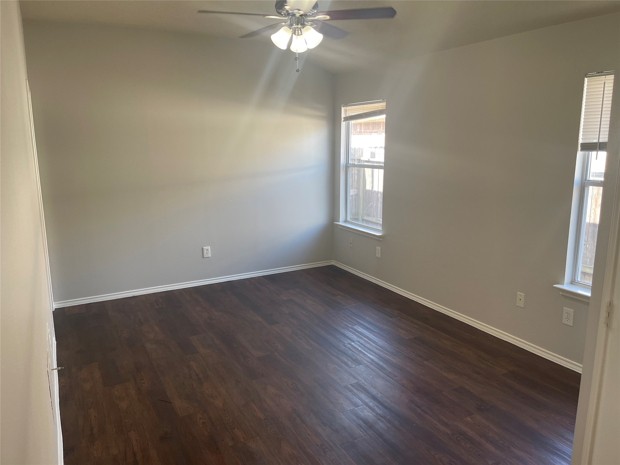 9011 Serena Lane Humble, TX 77338 - Photo 9 of 18 an empty room with wooden floor and windows