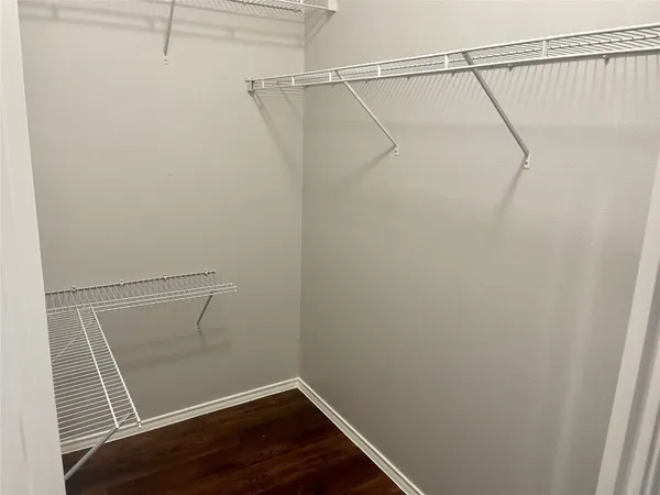 a view of a room with racks on the wall