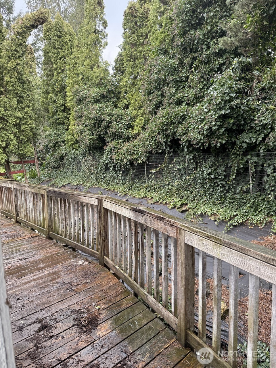 14003 70th Street East Sumner, WA 98390 - Photo 19 of 20 a balcony with wooden floor and fence