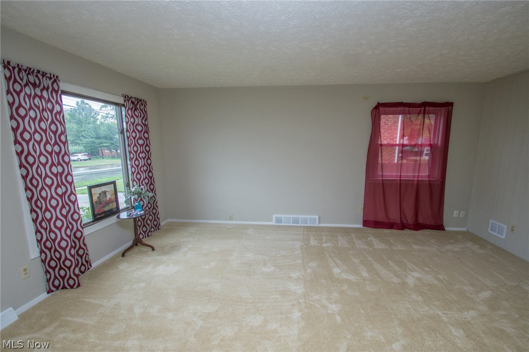 10571 Snow Road Parma Heights, OH 44130 - Photo 2 of 25 Living room with newer carpet