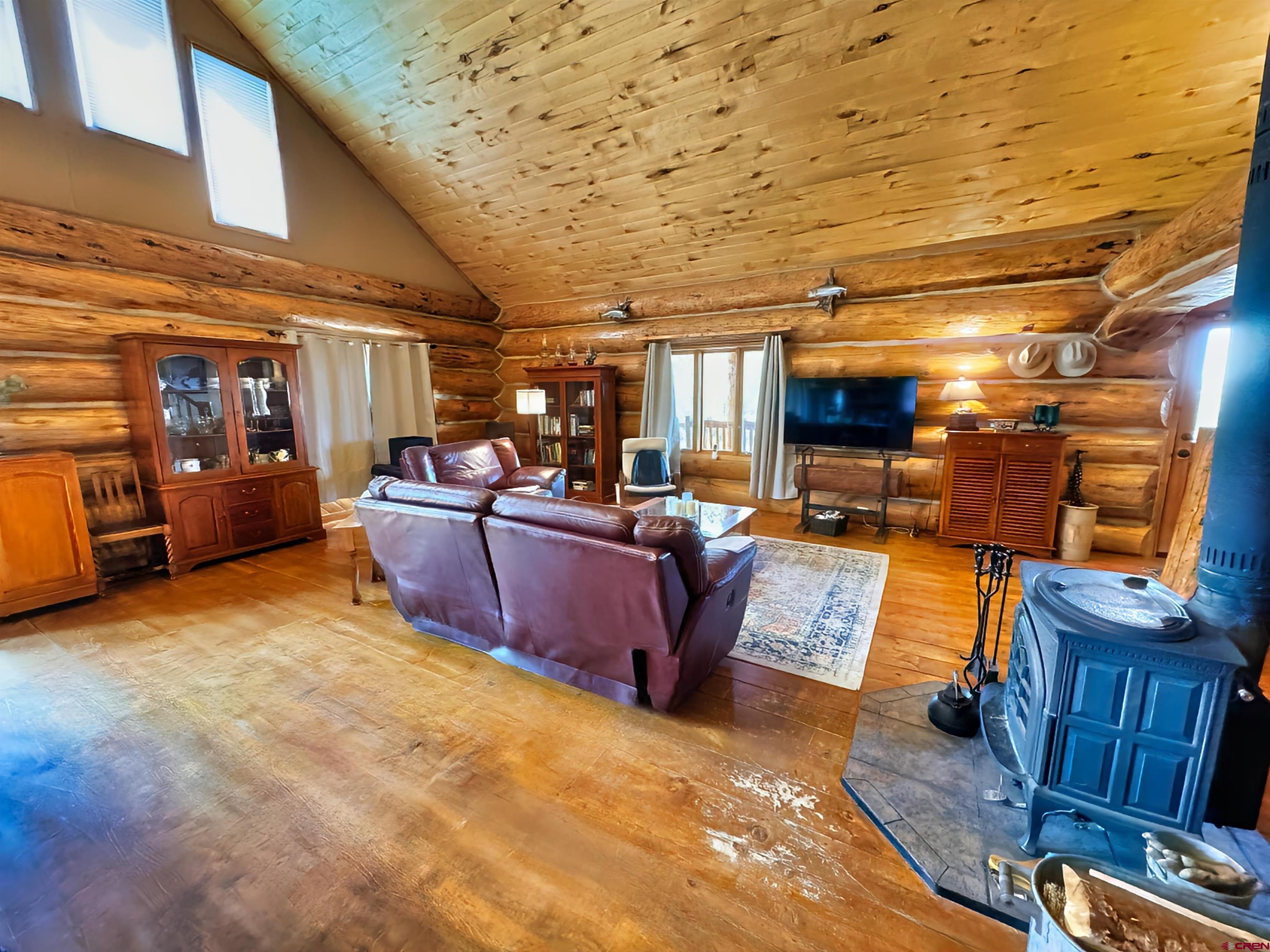 366 Frisco Pass Del Norte, CO 81132 - Photo 13 of 34 a view of a big room with wooden walls