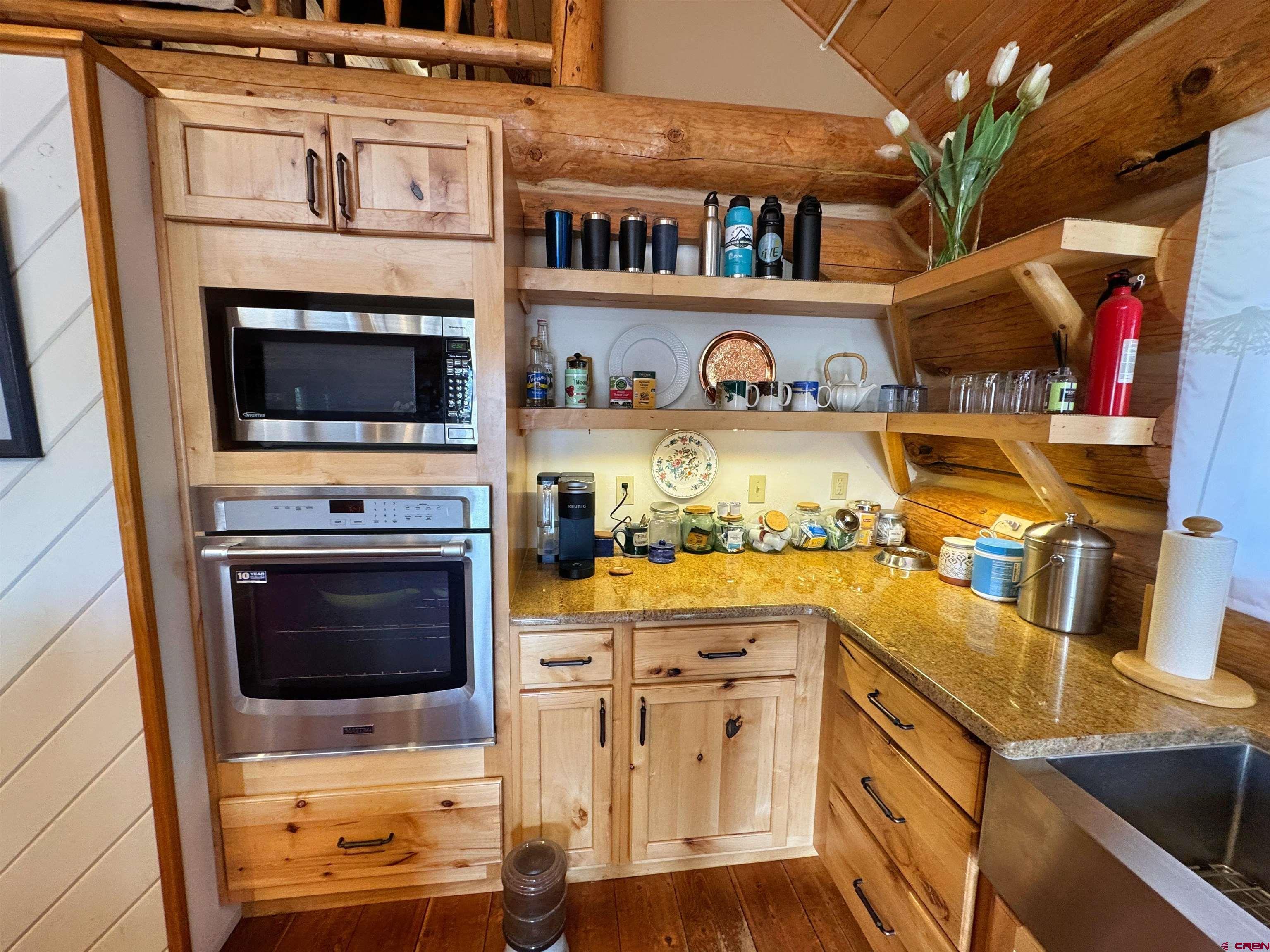 366 Frisco Pass Del Norte, CO 81132 - Photo 14 of 34 a kitchen with stainless steel appliances a stove and a microwave