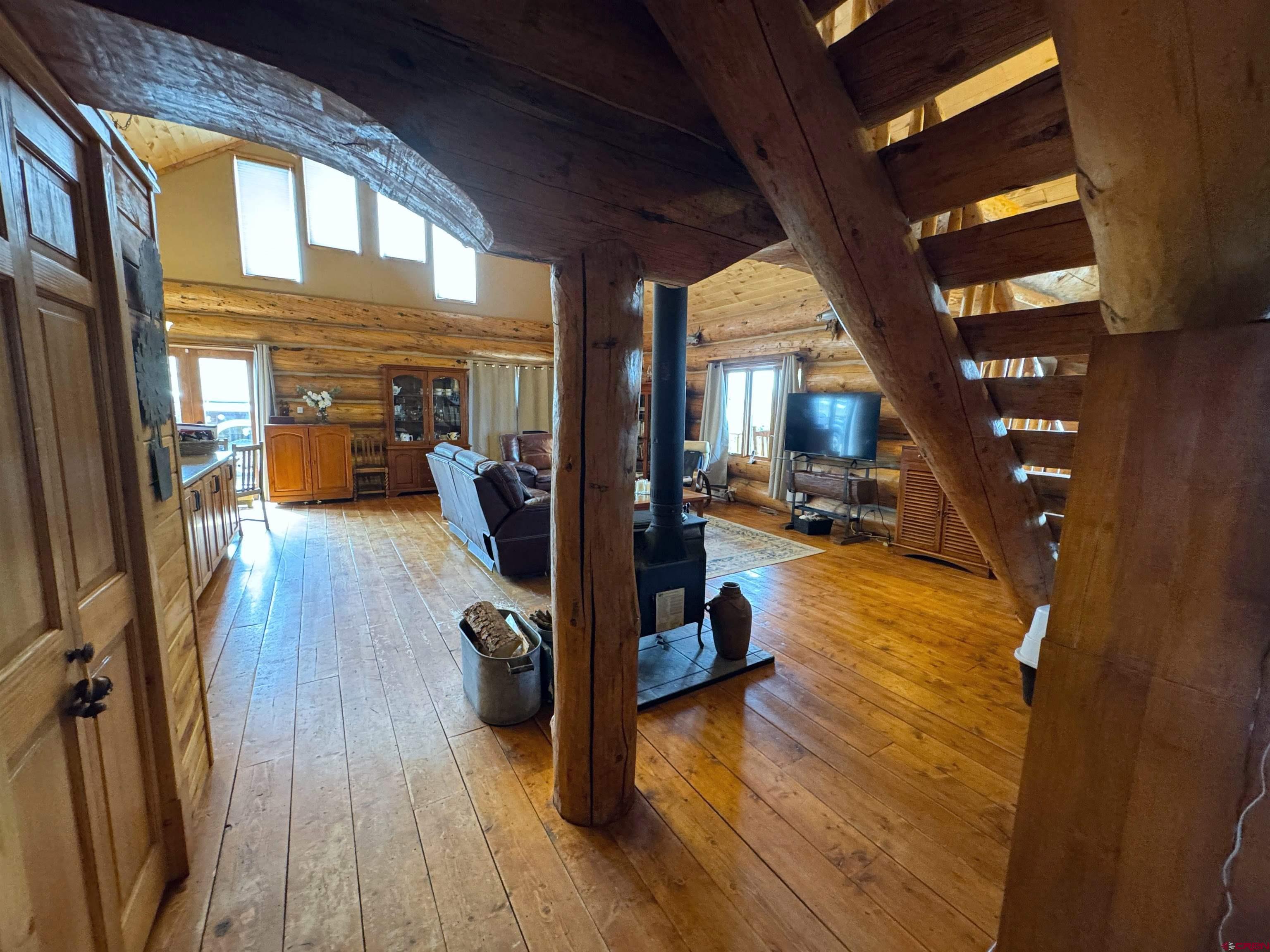 366 Frisco Pass Del Norte, CO 81132 - Photo 15 of 34 a view of a living room and bathroom with a hardwood floor