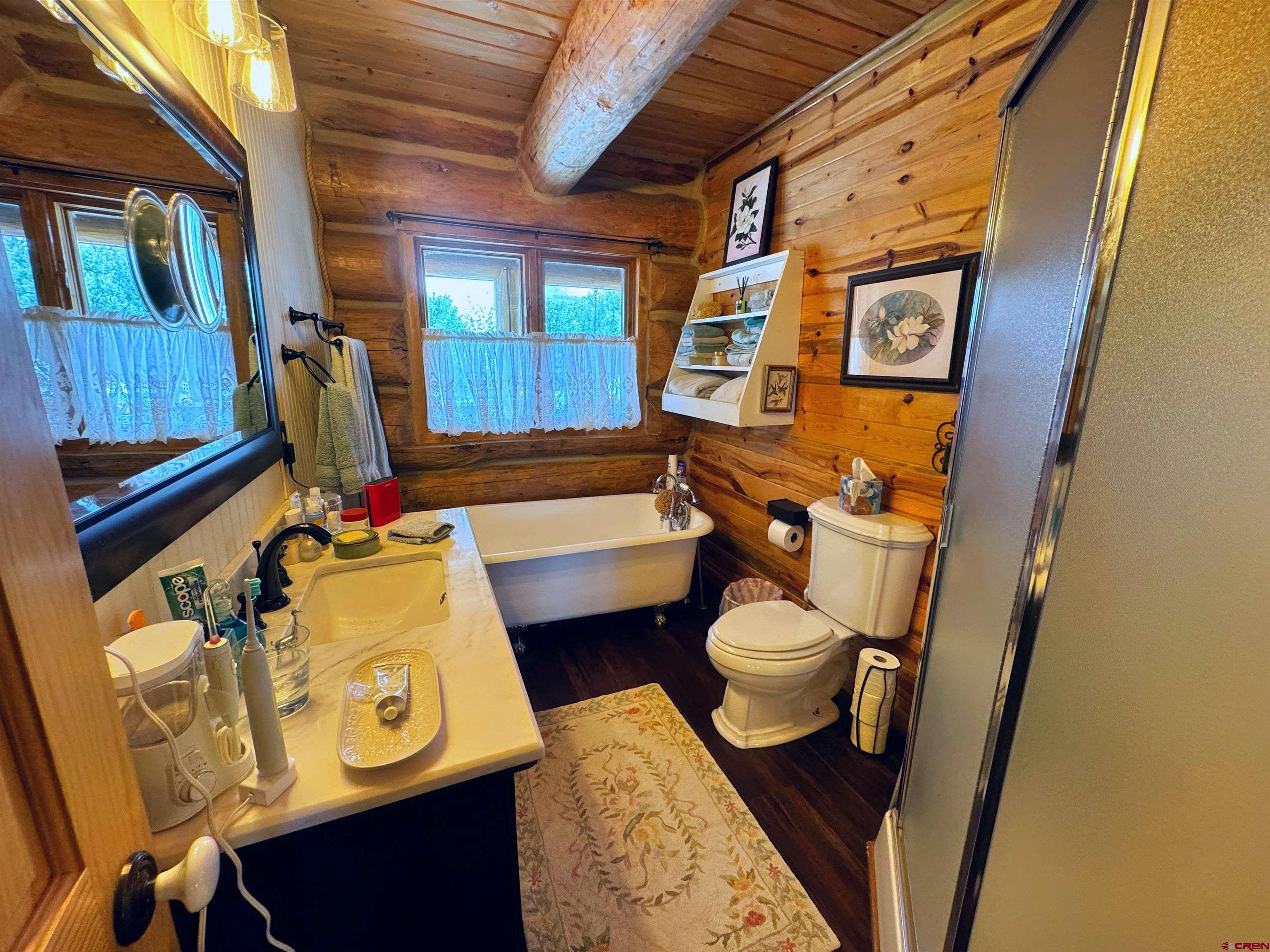 366 Frisco Pass Del Norte, CO 81132 - Photo 17 of 34 a bathroom with a toilet sink and mirror