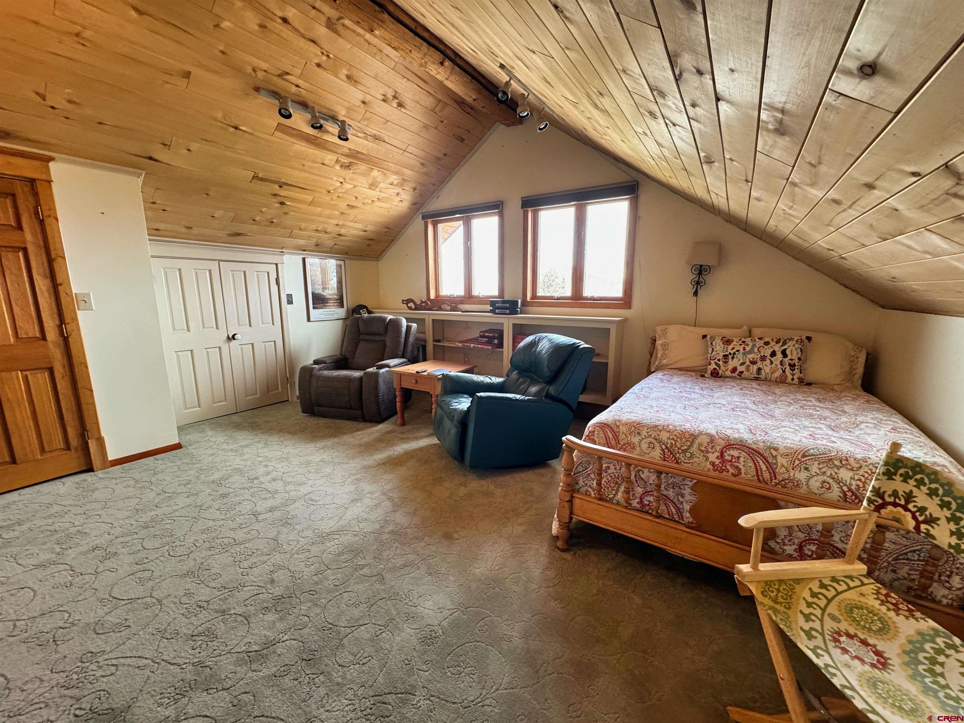 366 Frisco Pass Del Norte, CO 81132 - Photo 28 of 34 a bedroom with a bed couch and a window