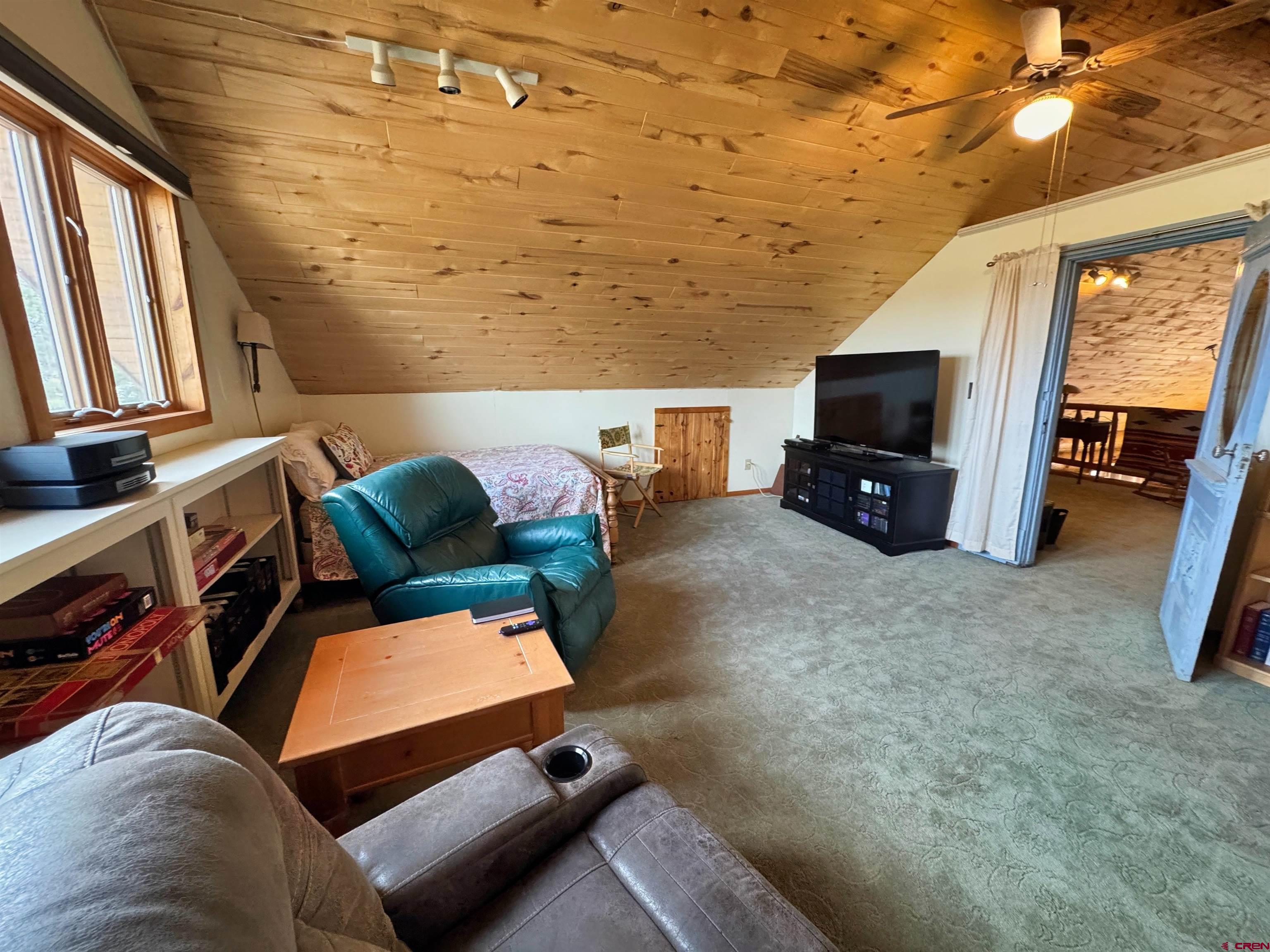 366 Frisco Pass Del Norte, CO 81132 - Photo 30 of 34 a living room with furniture and a flat screen tv