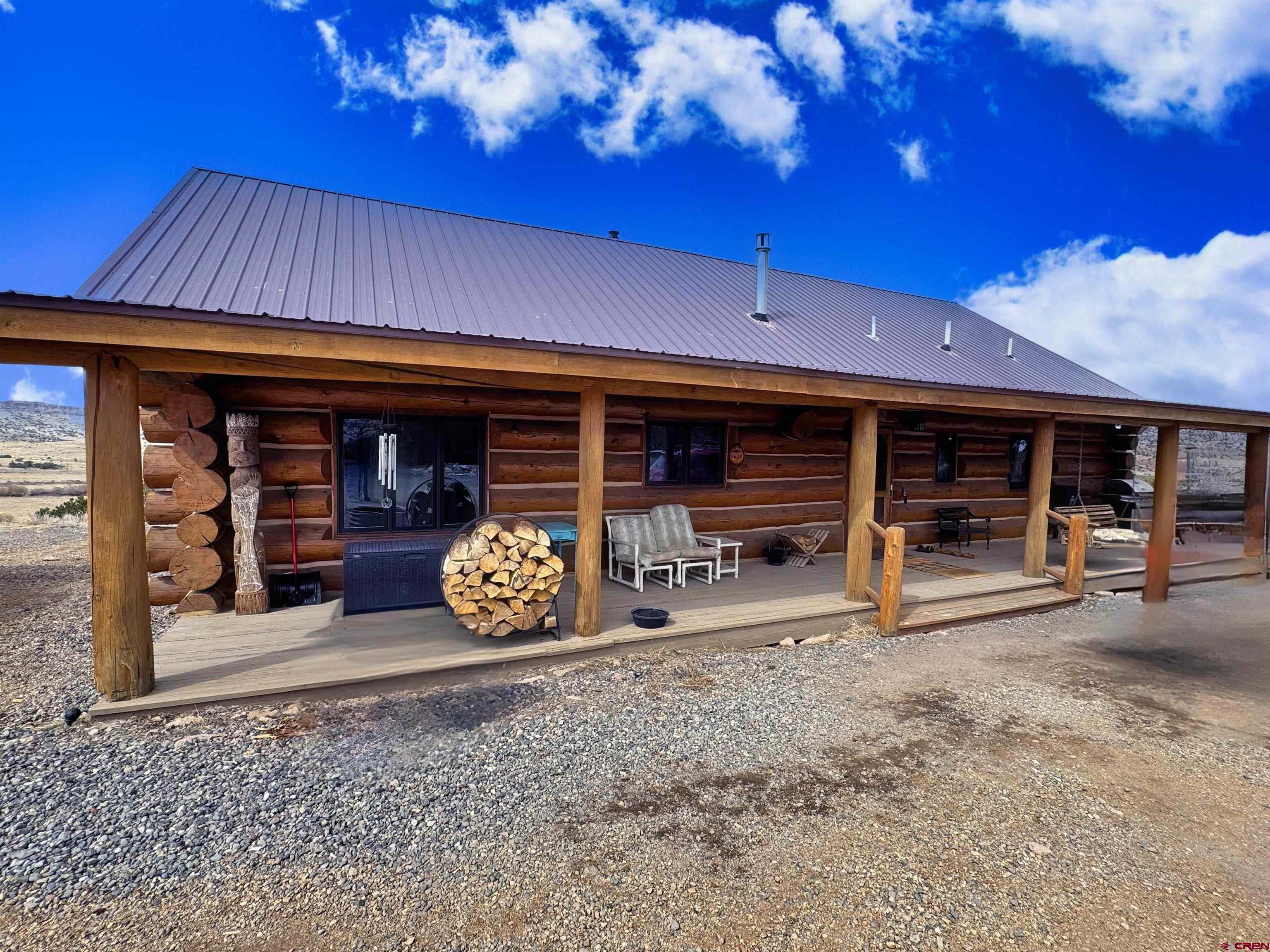 366 Frisco Pass Del Norte, CO 81132 - Photo 3 of 34 a view of a car park in front of retail shop