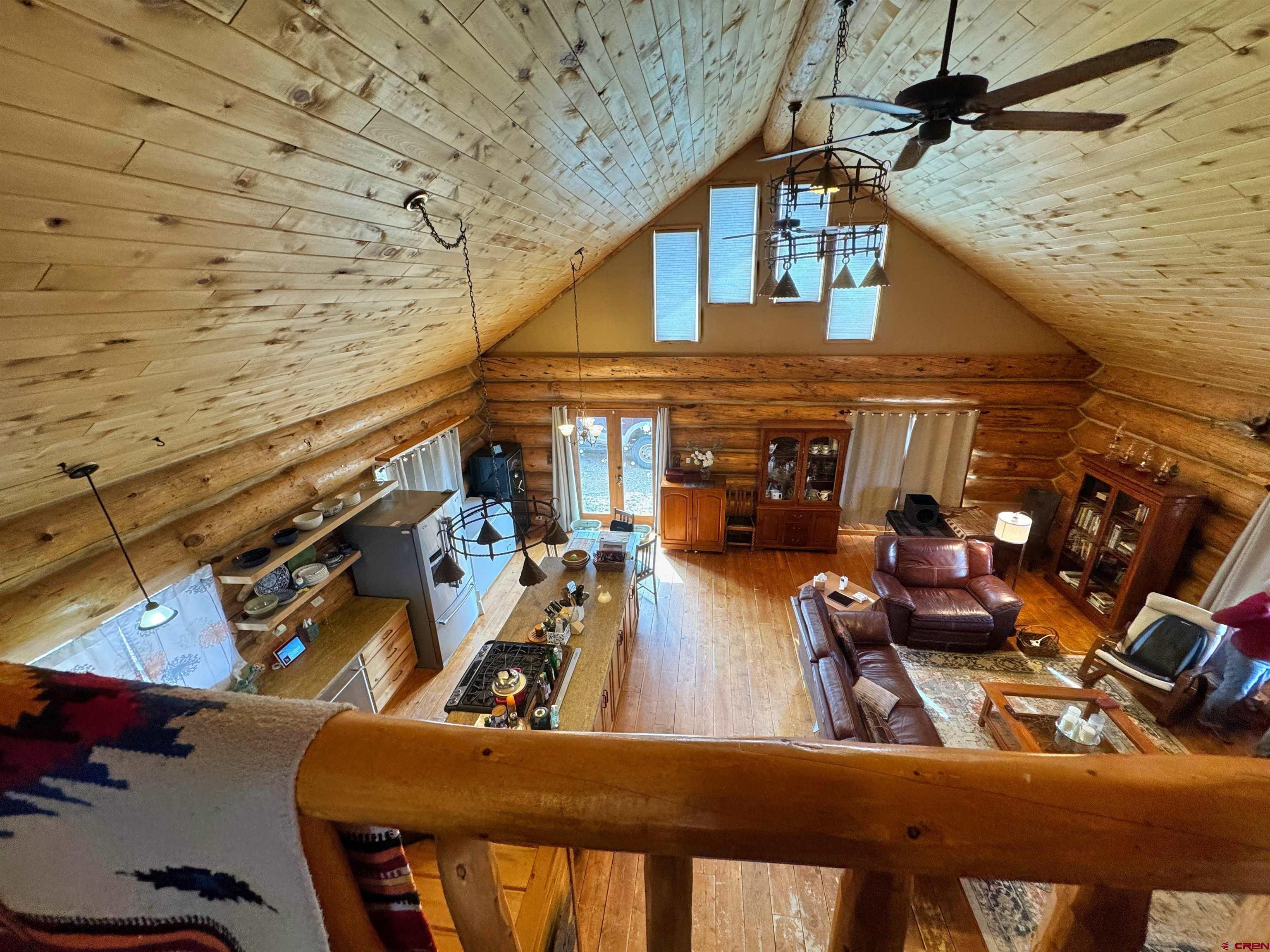 366 Frisco Pass Del Norte, CO 81132 - Photo 32 of 34 a view of a patio with couches chairs and potted plants