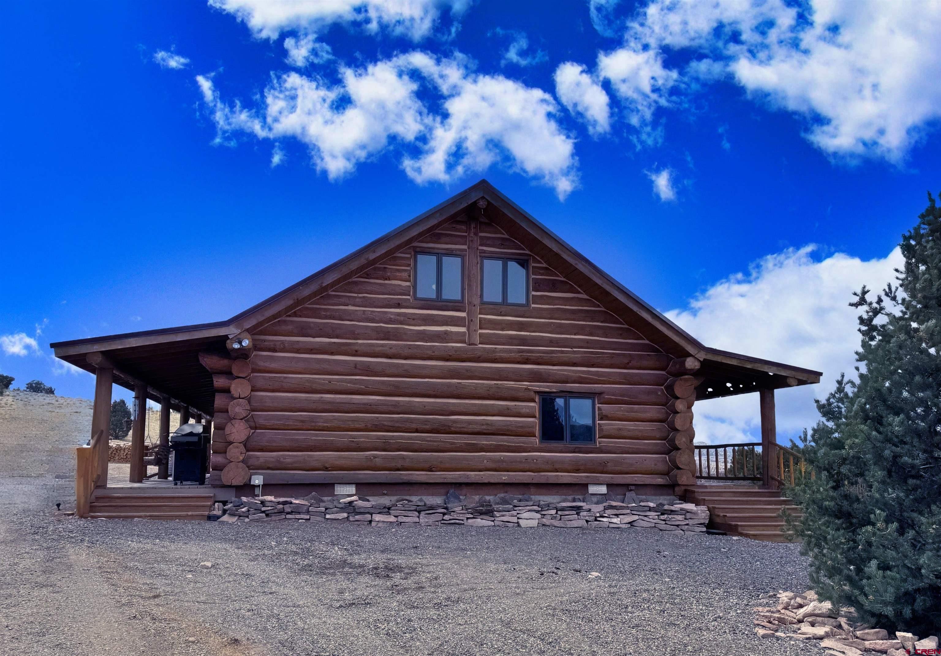 366 Frisco Pass Del Norte, CO 81132 - Photo 4 of 34 a view of a house with a yard