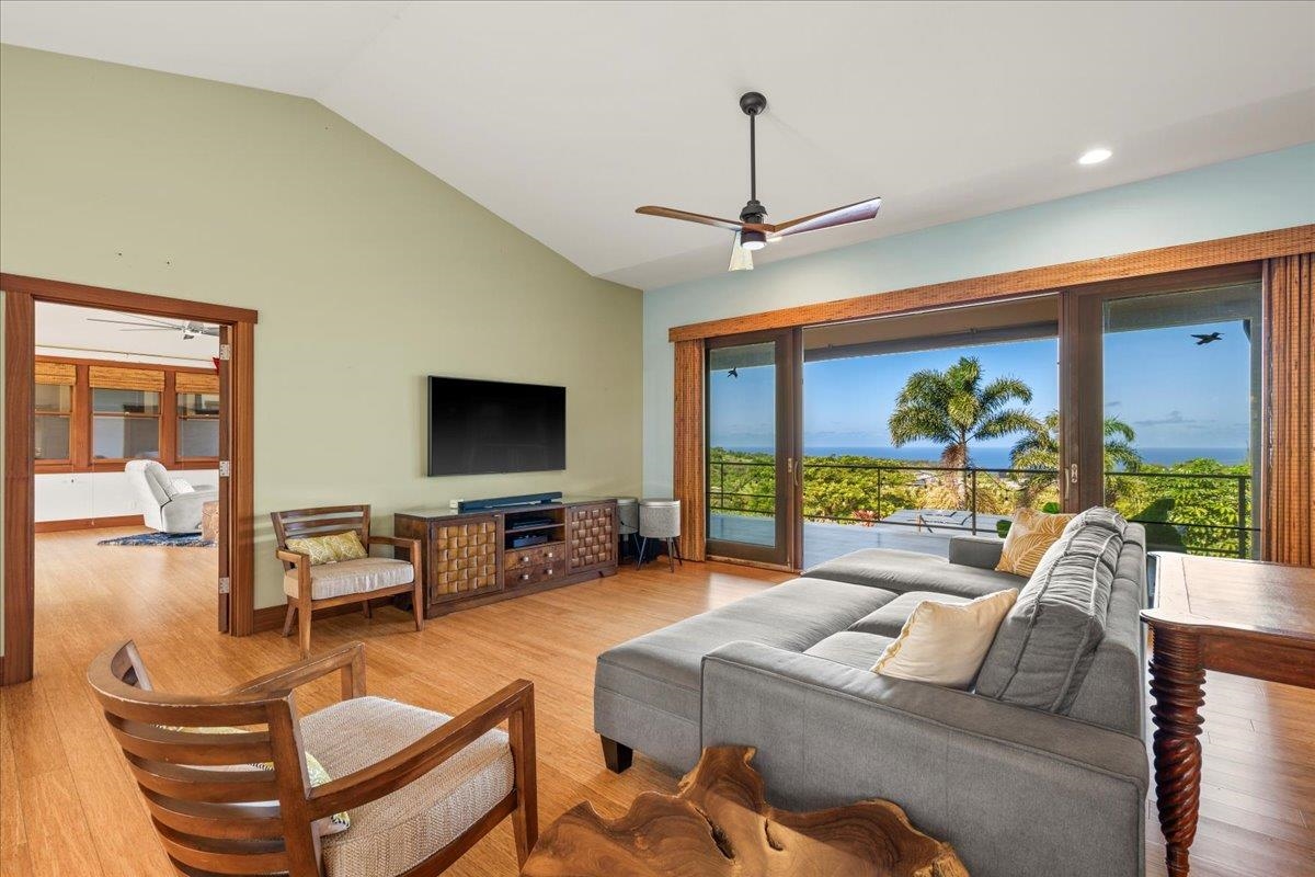 10 Leleaka Place Haiku, HI 96708 - Photo 12 of 49 a living room with furniture a ceiling fan and a large window