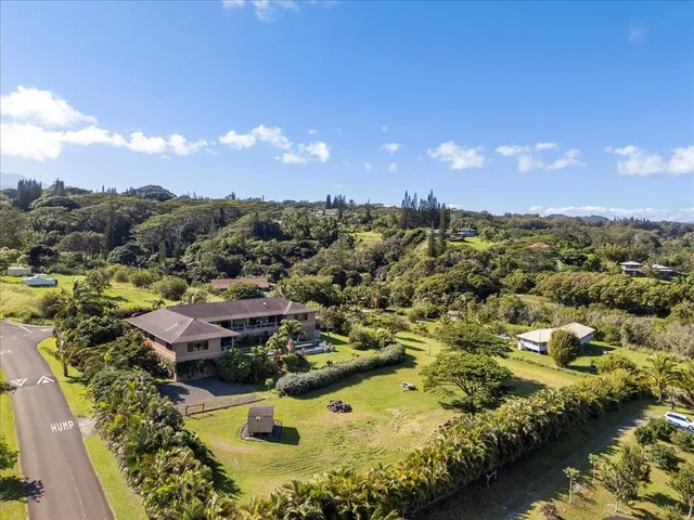 a backyard of a house with lots of green space