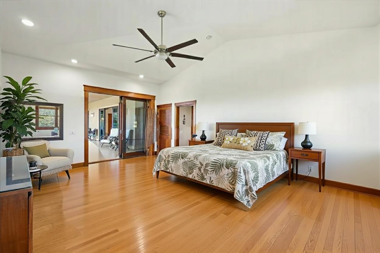 10 Leleaka Place Haiku, HI 96708 - Photo 37 of 49 a spacious bedroom with a bed and a wooden floor