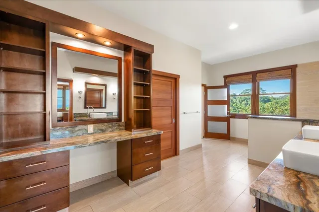 a view of an entryway with wooden floor