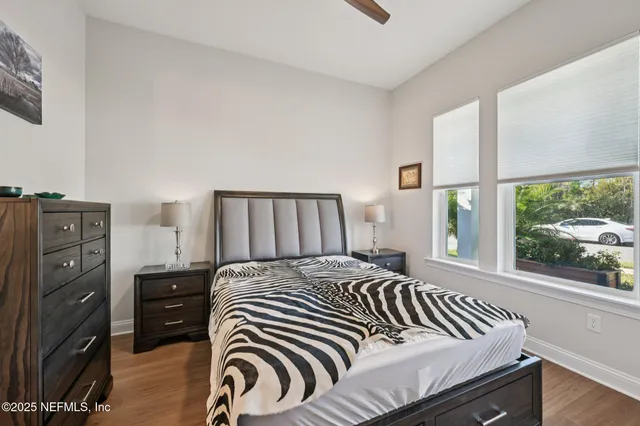 a bedroom with a bed and dresser