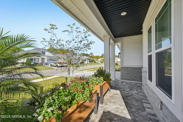 a view of a brick house with windows