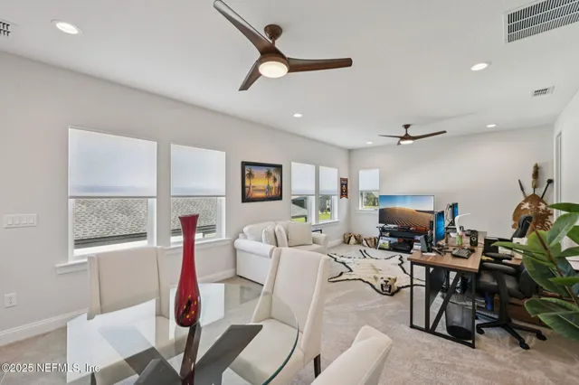 a bathroom with a sink toilet vanity and shower