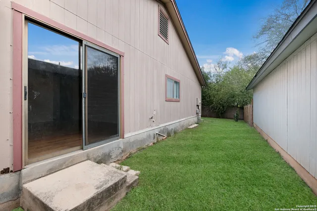 a backyard of a house with seating space