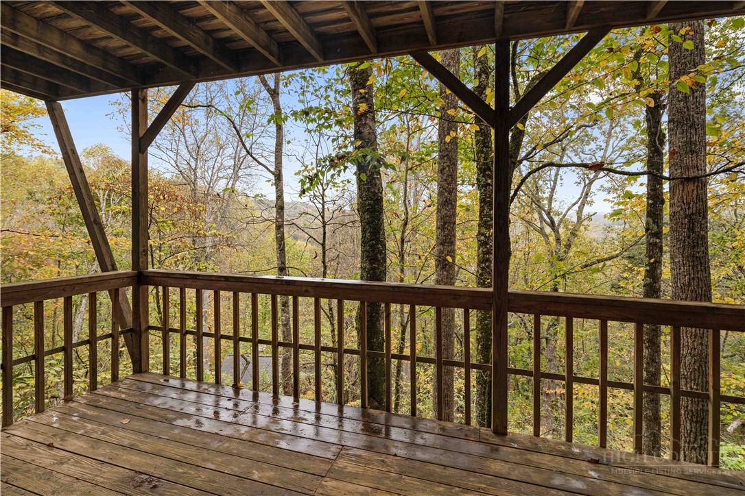 265 Leatherwood Road Banner Elk, NC 28604 - Photo 35 of 42 a wooden deck with trees in front of it