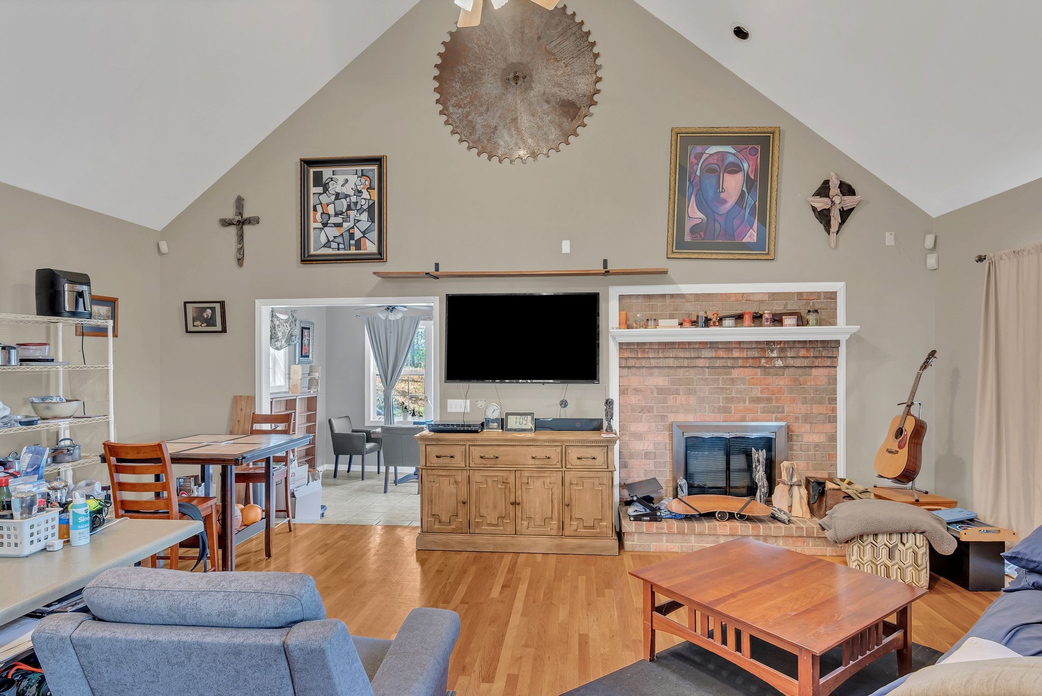 8242 River Rd Pike Nashville, TN 37209 - Photo 11 of 35 a living room with furniture a flat screen tv and a fireplace