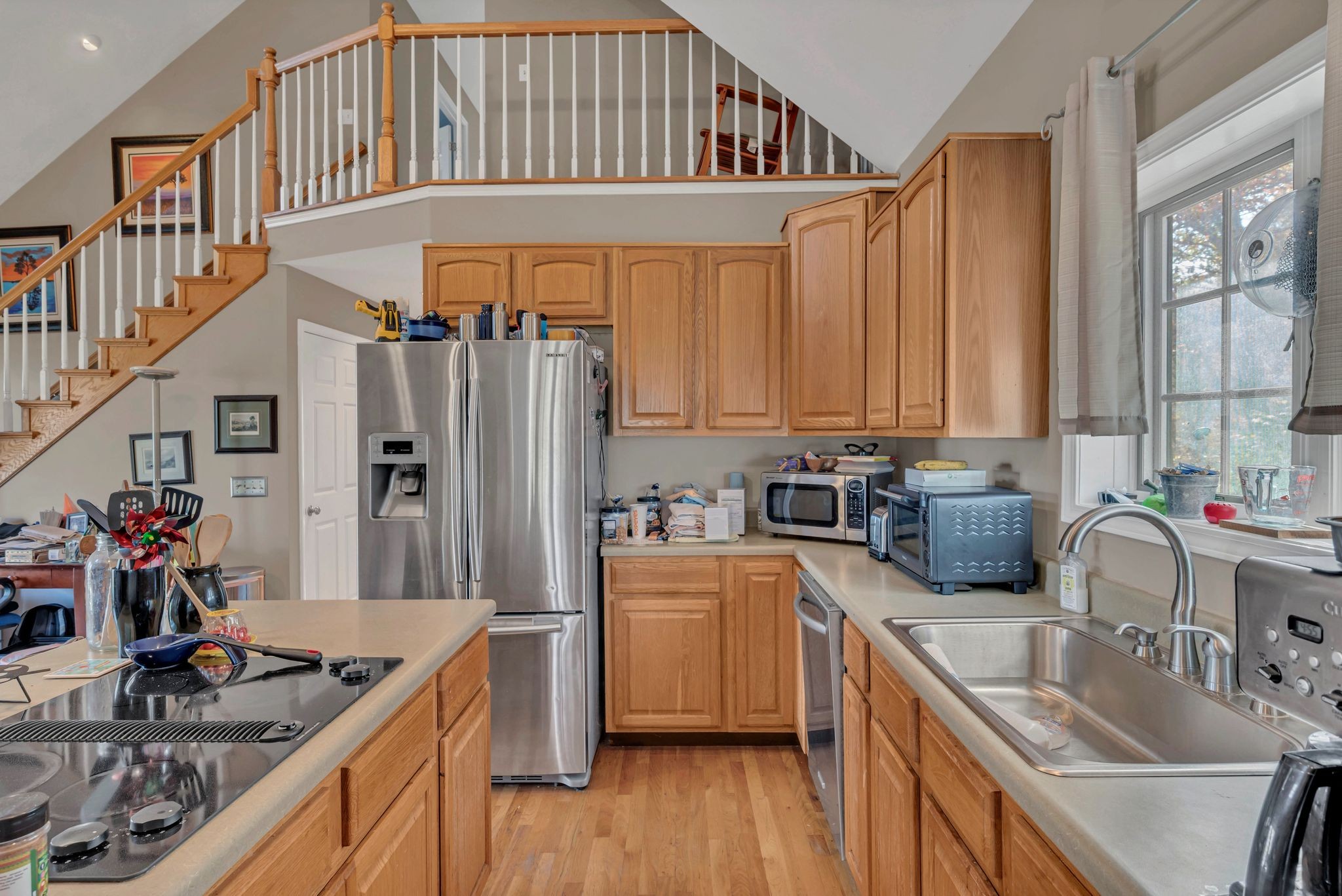 8242 River Rd Pike Nashville, TN 37209 - Photo 17 of 35 a kitchen that has a sink cabinets counter space and a window