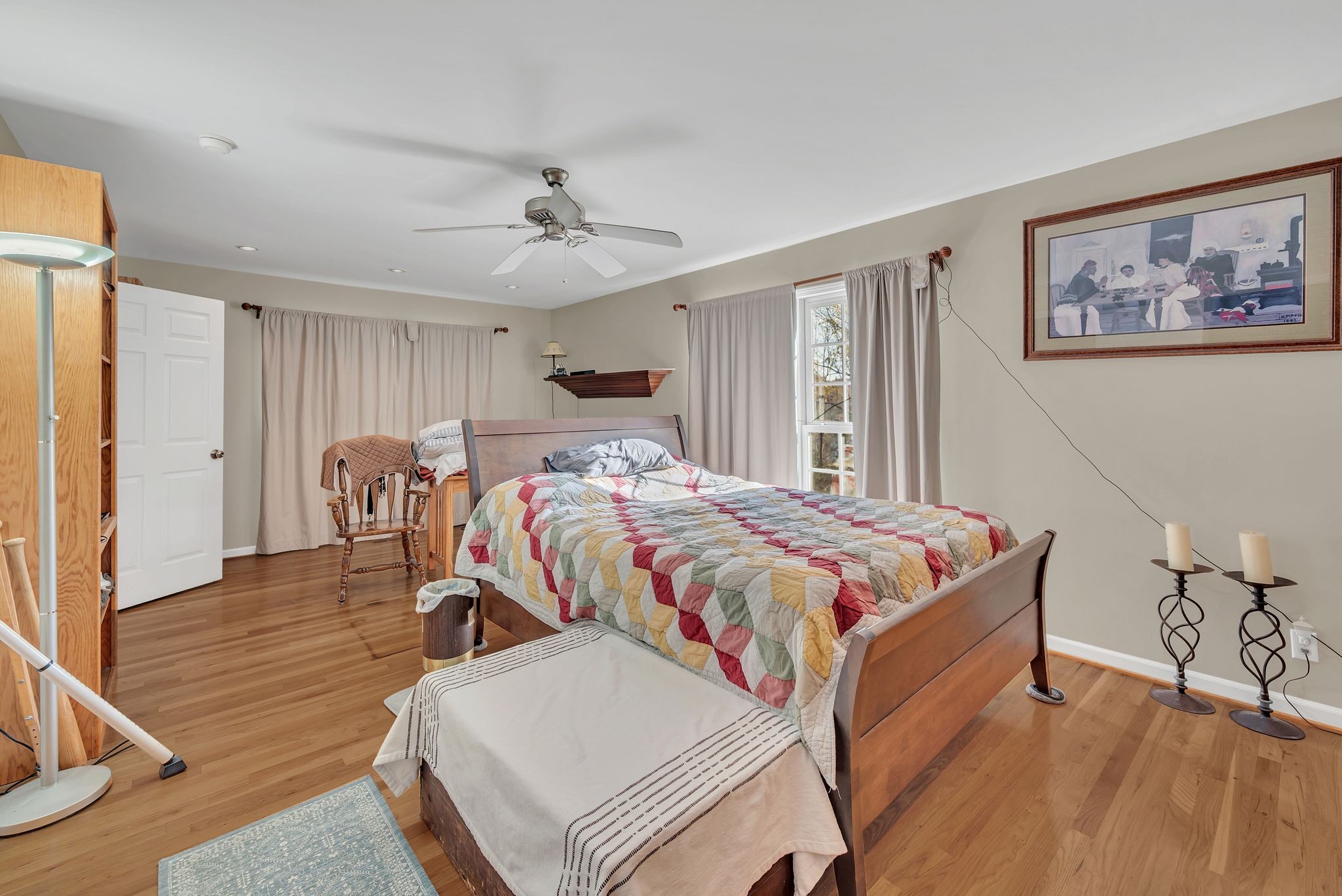 8242 River Rd Pike Nashville, TN 37209 - Photo 18 of 35 a bed room with a bed and a chandelier