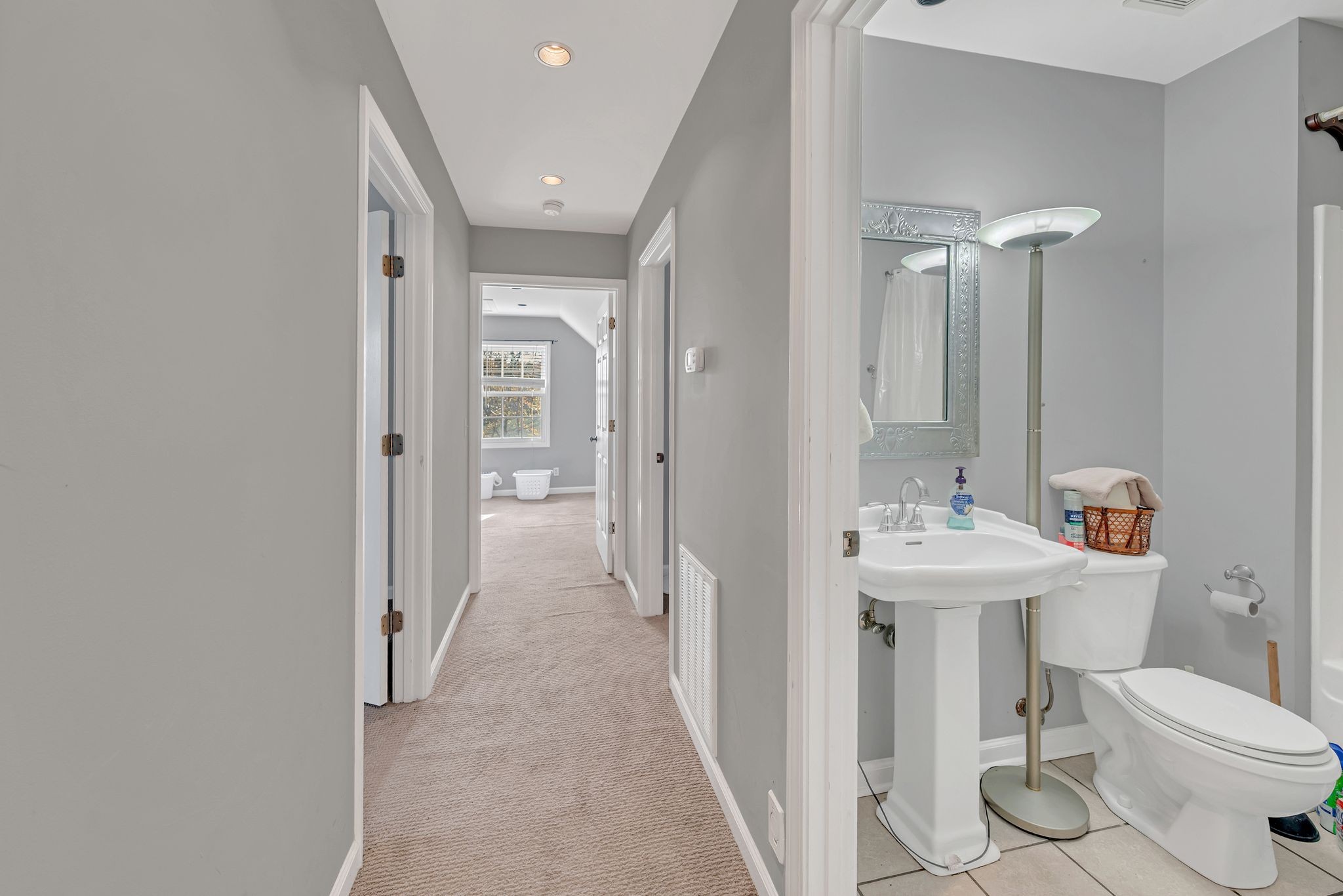 8242 River Rd Pike Nashville, TN 37209 - Photo 21 of 35 a bathroom with a sink toilet and shower