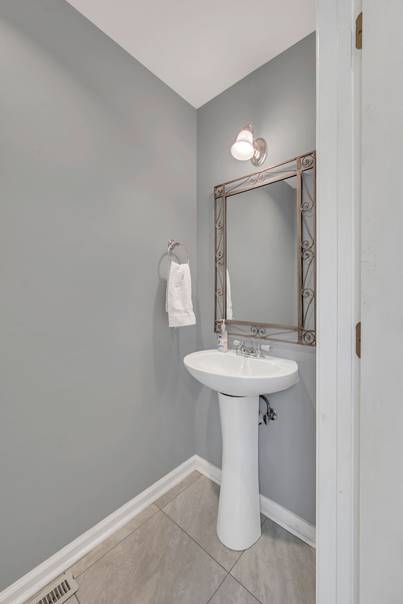 8242 River Rd Pike Nashville, TN 37209 - Photo 22 of 35 a bathroom with a sink a mirror and toilet