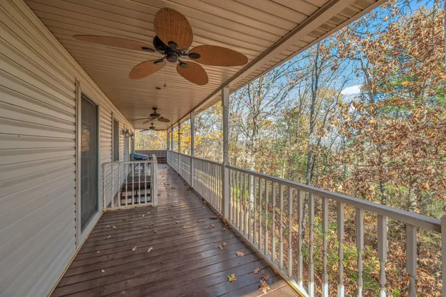a view of a balcony with wooden floor