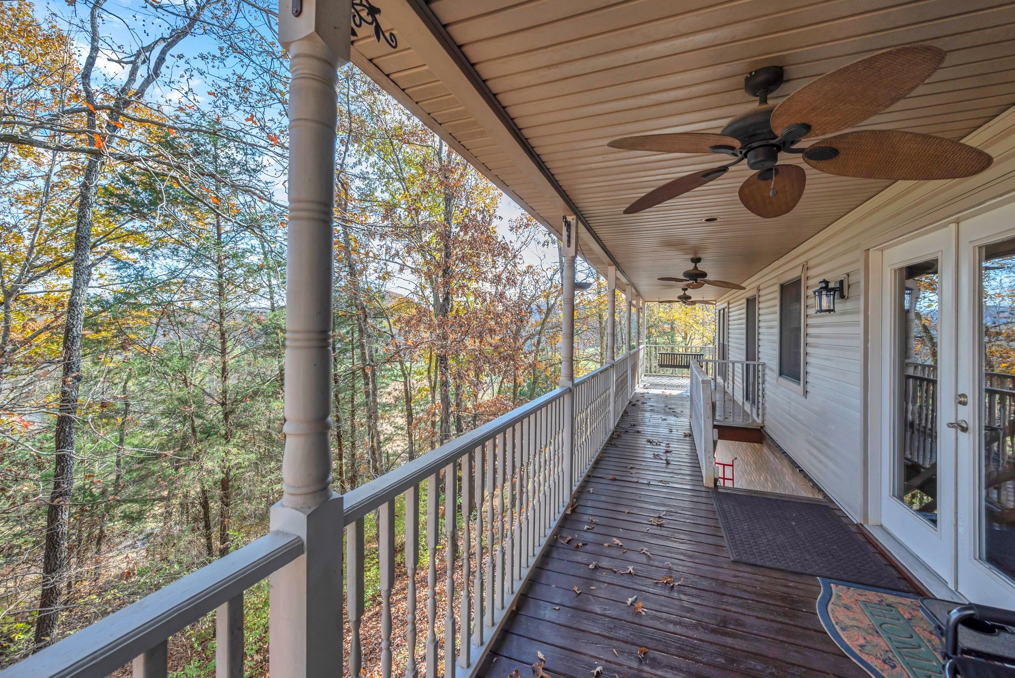 8242 River Rd Pike Nashville, TN 37209 - Photo 5 of 35 a view of a porch with wooden floor and outdoor space