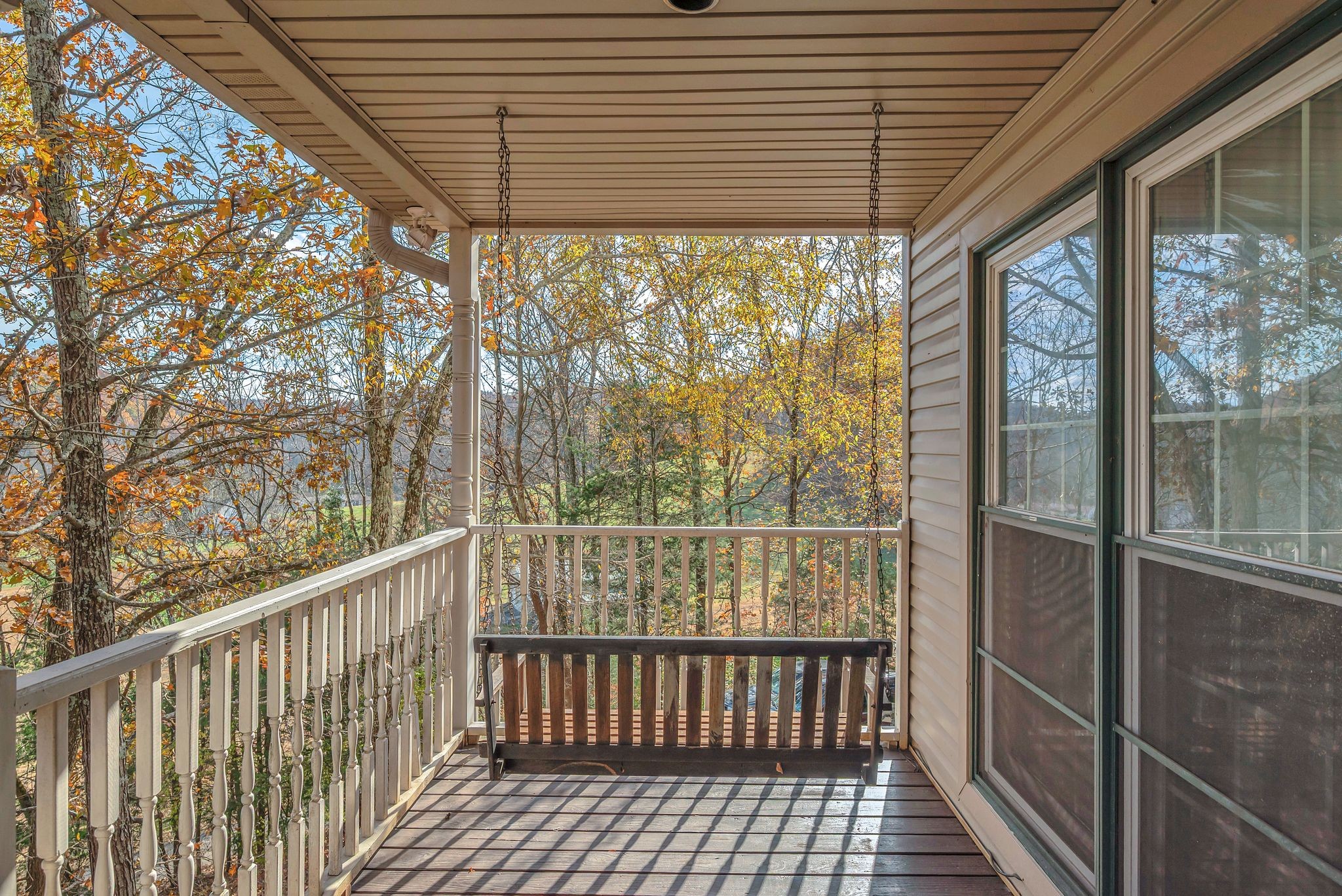 8242 River Rd Pike Nashville, TN 37209 - Photo 7 of 35 a view of a porch with wooden floor and outdoor space