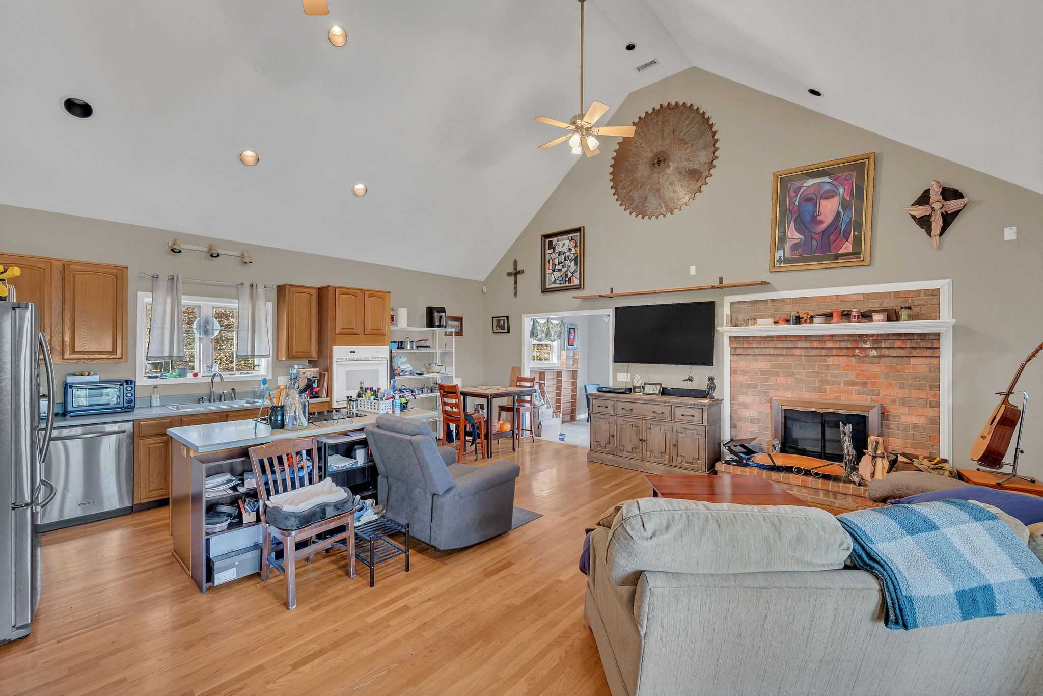 8242 River Rd Pike Nashville, TN 37209 - Photo 10 of 35 a living room with furniture a fireplace and a flat screen tv