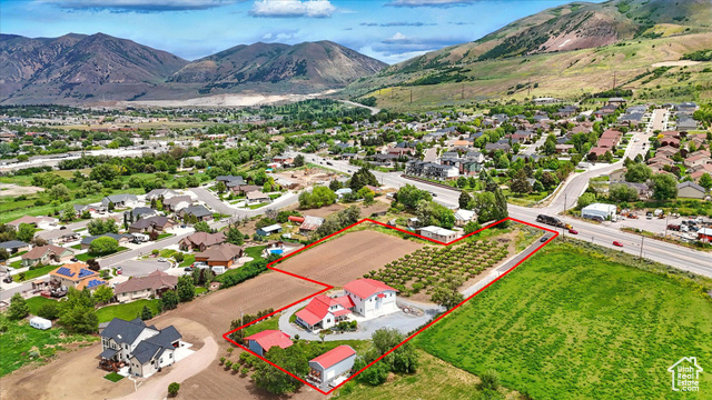 Undisclosed Address Brigham City, UT 84302 - Photo 1 of 1 Aerial view of property's location with mountains and property boundaries highlighted