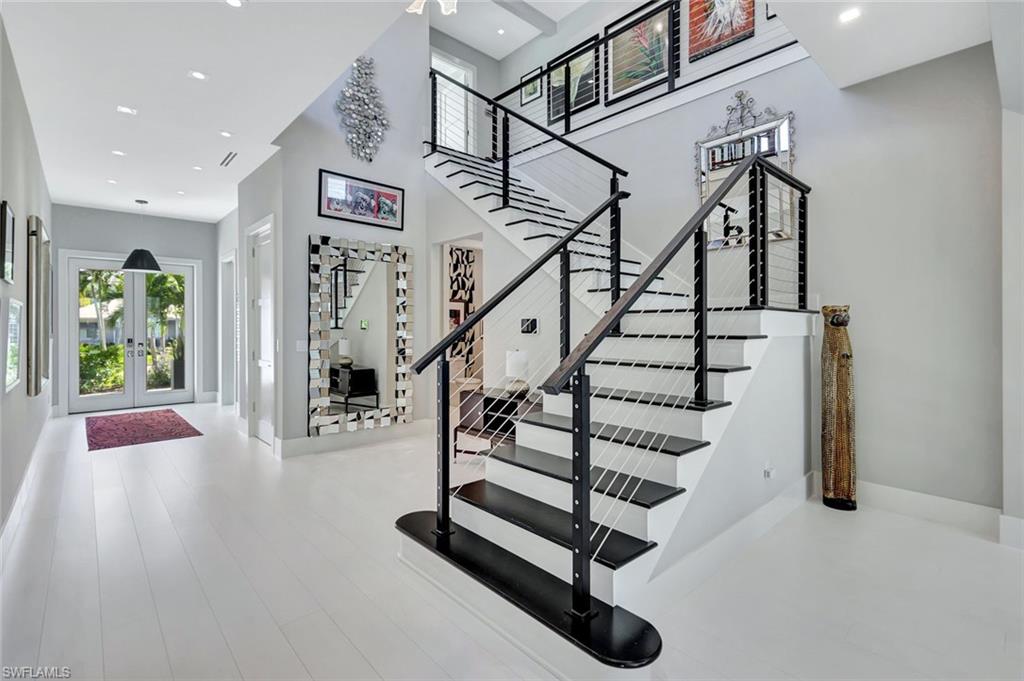 739 5th Avenue North Naples, FL 34102 - Photo 15 of 35 a view of entryway with wooden floor and window