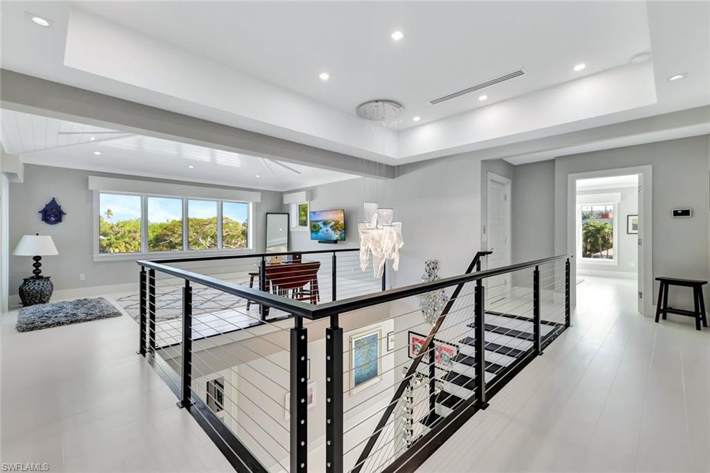 739 5th Avenue North Naples, FL 34102 - Photo 17 of 35 a view of entryway livingroom and hall with wooden floor