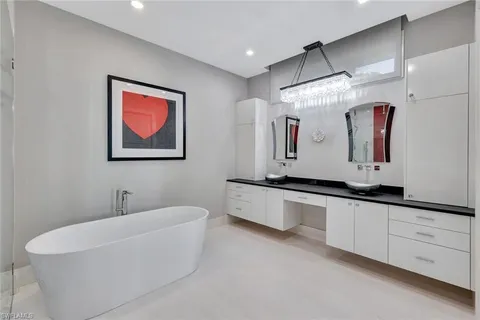 a bedroom with a large bed and a couch