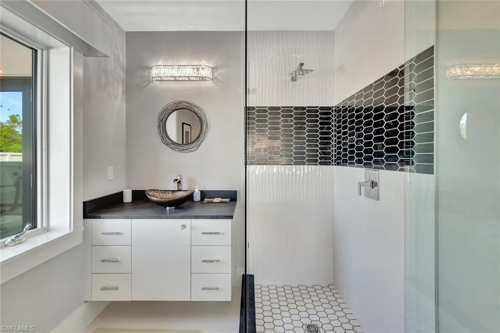 739 5th Avenue North Naples, FL 34102 - Photo 27 of 35 a kitchen with a sink a stove and cabinets