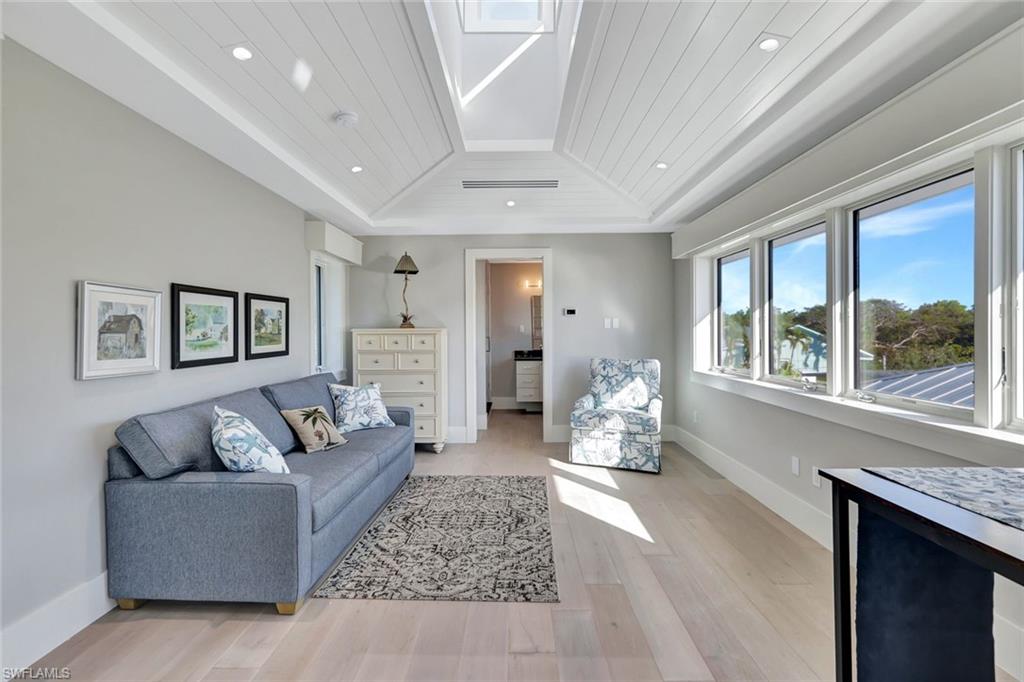 739 5th Avenue North Naples, FL 34102 - Photo 33 of 35 a living room with furniture and wooden floor