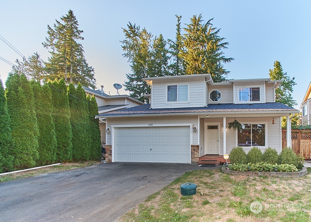 133 120th Street Southeast, Unit B Everett, WA 98208 - Photo 1 of 14 front view of a house with a yard