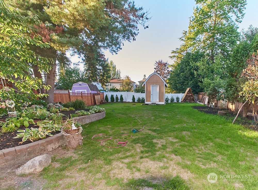 133 120th Street Southeast, Unit B Everett, WA 98208 - Photo 12 of 14 a view of a house with backyard and sitting area