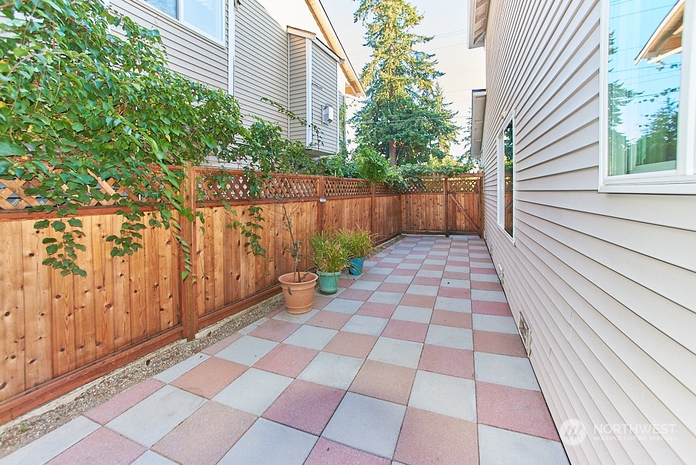 133 120th Street Southeast, Unit B Everett, WA 98208 - Photo 14 of 14 a view of a yard with a white house and wooden floor