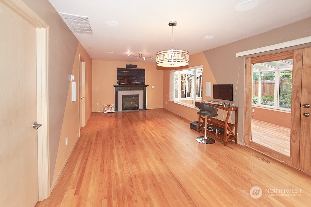 133 120th Street Southeast, Unit B Everett, WA 98208 - Photo 3 of 14 a view of a livingroom with wooden floor and furniture