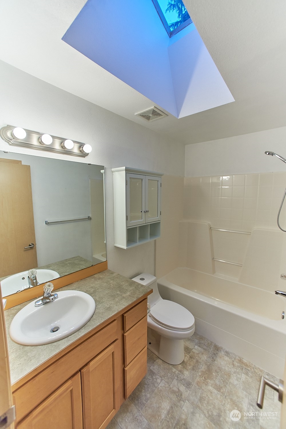 133 120th Street Southeast, Unit B Everett, WA 98208 - Photo 8 of 14 a bathroom with a sink a toilet a mirror and shower