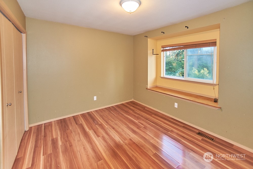 133 120th Street Southeast, Unit B Everett, WA 98208 - Photo 9 of 14 a view of a room with wooden floor and a window