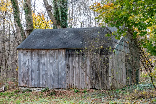 a backyard of a house with lots of green space