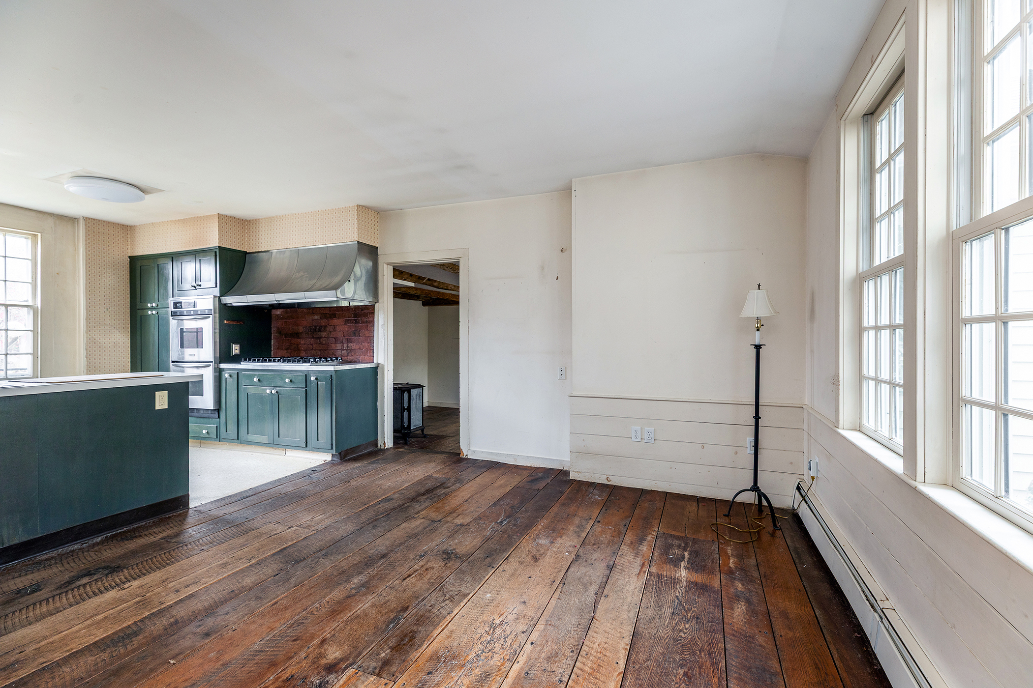 28 Sunny Ridge Road Washington, CT 06793 - Photo 7 of 35 a view of a kitchen with wooden floor and a window