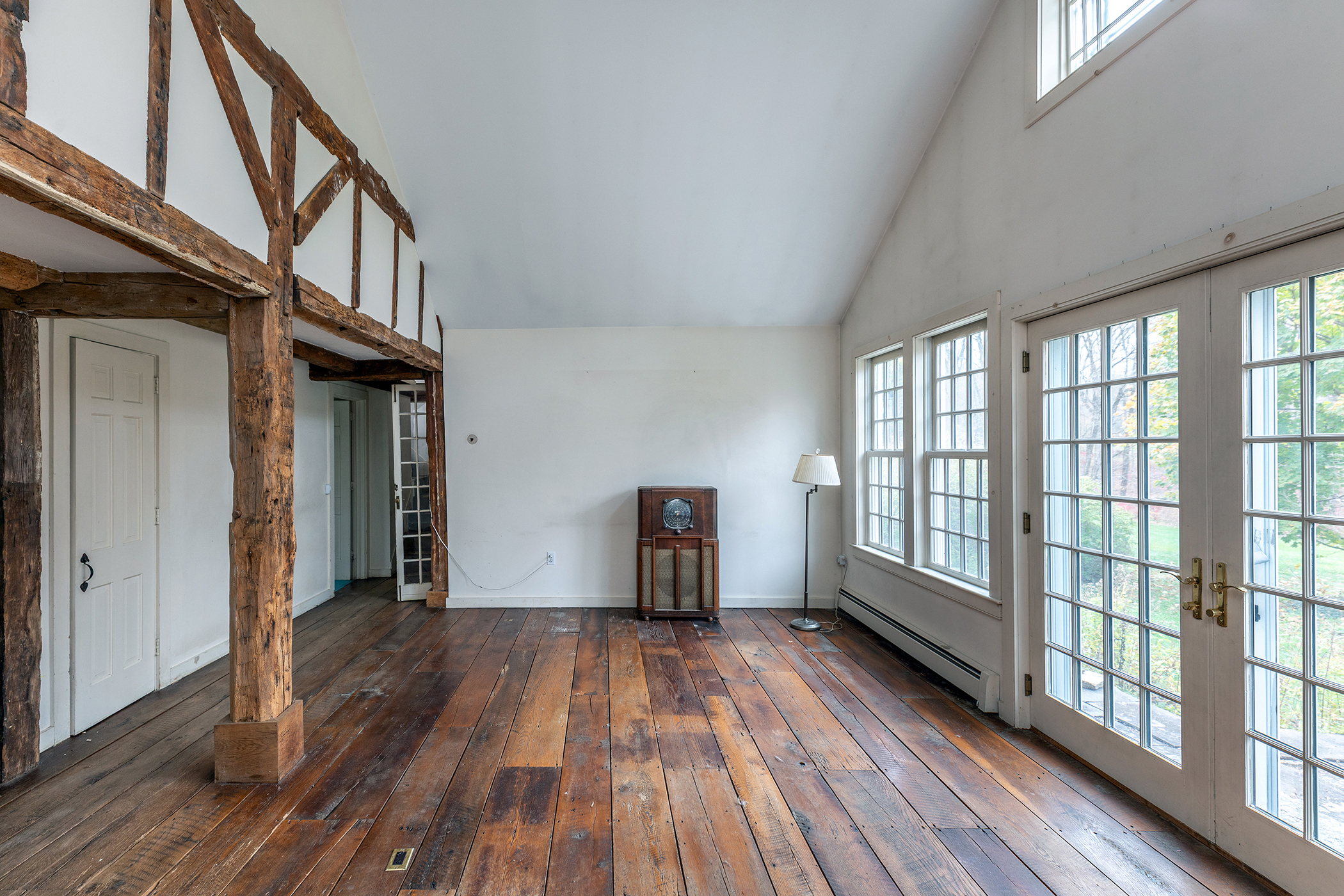 28 Sunny Ridge Road Washington, CT 06793 - Photo 8 of 35 a view of empty room with wooden floor and fan