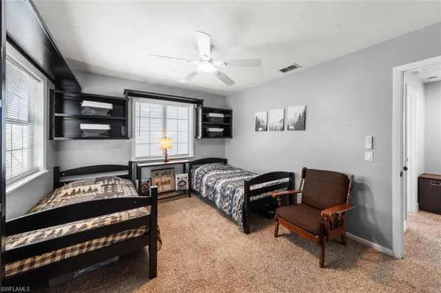 a bedroom with furniture and a window